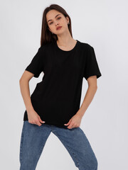 mockup of a black loose-fitting t-shirt on a young beautiful girl