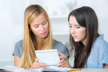 two females student learning together for exam