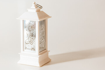Arabian white lantern on a light background. Islamic holidays concept. Ramadan background. Ramadan...