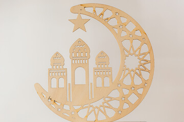 Wooden decor for Ramadan Kareem holiday on a light background