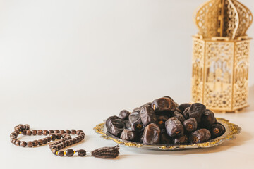 Arabian lantern, dates and rosary. Islamic holidays concept. Ramadan decoration. Ramadan kareem.