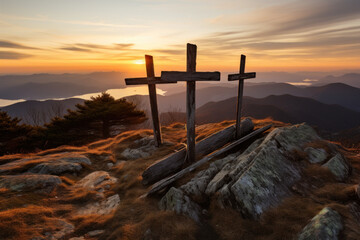 Sunset behind three rustic crosses on mountain peak - 747074850