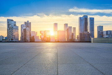 Empty square floors and modern city commercial buildings at sunset in Shenzhen
