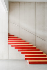 Fototapeta na wymiar Red stairs in a big building