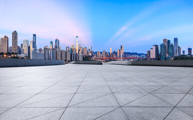 Empty square floor and skyline with modern buildings at dusk in Chongqing. Panoramic view.
