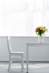 vase flowers white table light