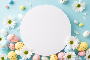 Easter mood setup: Flat-lay top view photograph of vibrant eggs, and spring daisies on a gentle...