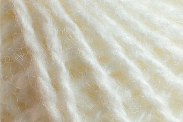 A close-up of the white thread for the background