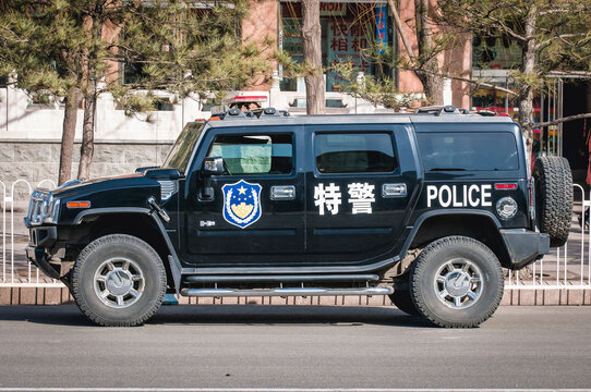 Beijing, China - March 27, 2013: Hummer H2 police car on Tiananmen Square in Beijing city