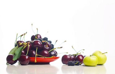 There are red cherries on a white background