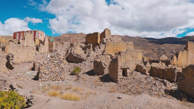Old Hikkim Monastery's ruins on the cliff near Hikkim village at Spiti Valley, India. Ruins of old build structure with clouds in sky. Spiti valley tourism and holidays during summer season.