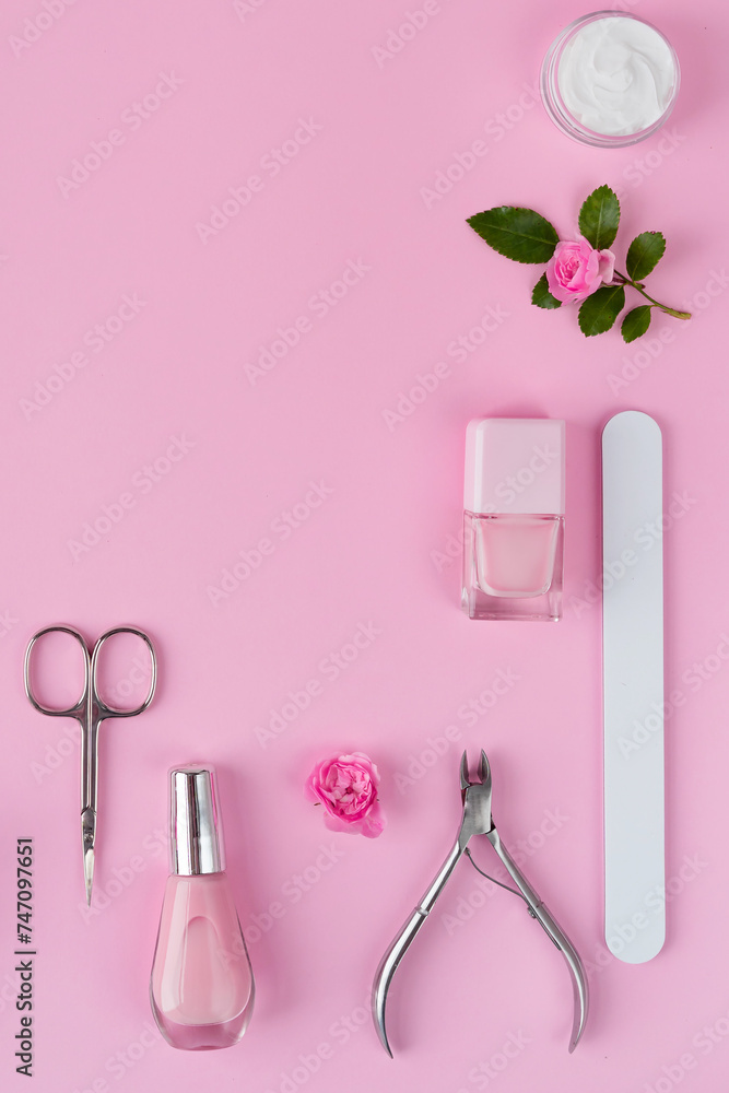 Wall mural Manicure and pedicure toots on pink background for banner. spa salon for your nail. Beautu concept. flat lay