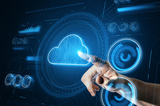 A hand selects a cloud symbol representing cloud computing services amidst a tech-oriented backdrop