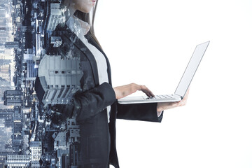 A double exposure image blending a woman using laptop with city skyline, projecting themes of...
