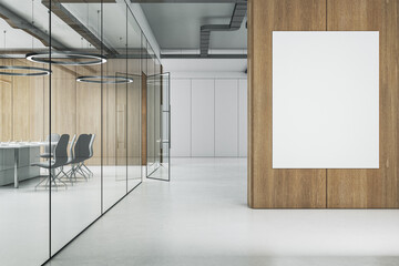 Modern wooden, glass and concrete office interior with white mock up banner on wall and daylight....