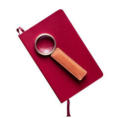Red-covered book and magnifying glass isolated on a white background close up - 747115602