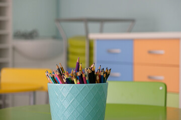 pencils in a cup inside a classroom in a primary school
