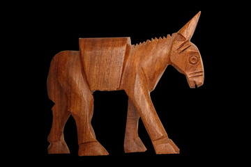 Hand Carved Wooden small Donkey isolated on Black background 

