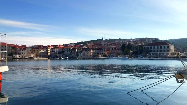 Slow motion view of beautiful seaside town. Postira harbour. Coastal town of Postira. Brac Island, Croatia. Europe.