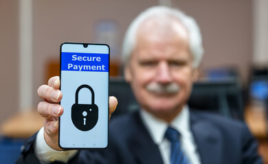 Elderly man holding a mobile phone with the text 'secure payment'. Symbol for internet safety for elderly people.