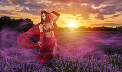 Beautiful arab belly dancer in a lavender field