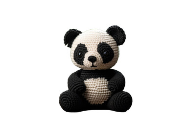 Crocheted Panda Bear Sitting. A handmade crocheted panda bears black and white colors stand out against the neutral backdrop. Isolated on a Transparent Background PNG.