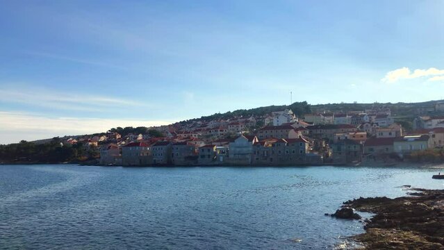 View of beautiful European seaside town. Coastal town of Postira. Brac Island, Croatia. Europe.
