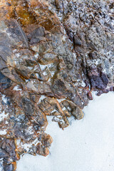 Stones on the sandy beach. There is space for entering text.
