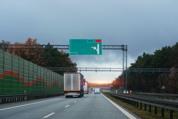 Truck driver seat view. Cockpit view from the car. European autobahn and vehicles in motion.	