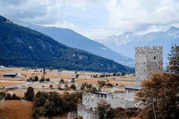 Burgusio, South Tyrol, northern Italy. Marienberg Abbey and its castle dominate the landscape of Val Venosta. View from outside. - obrazy, fototapety, plakaty