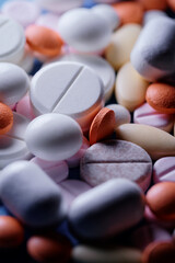 Medicine and drug concept. Close up shot of white and colored pills  of different kinds.