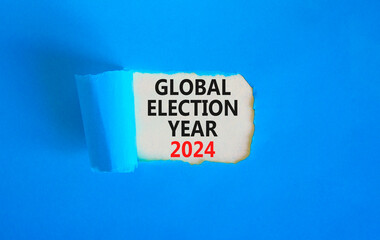 Global election year 2024 symbol. Concept words Global election year 2024 on beautiful white paper. Beautiful blue background. Business Global election year 2024 concept. Copy space