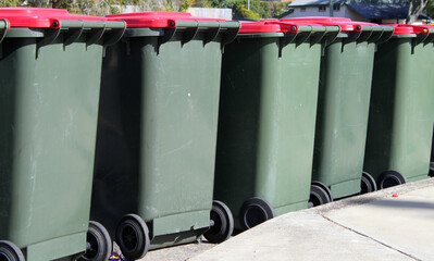 Row of rubbish bins on a street