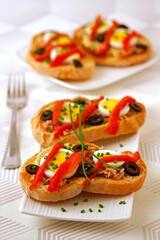 Bruschettas with tuna and pepper.