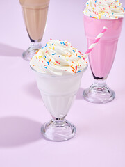 Cream milkshakes and summer mood. Delicious dessert and pleasure.