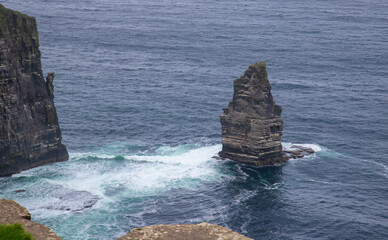 Breanan Mór and Cliffs of Moher on a cloudy day in County Clare, Ireland