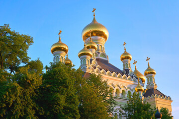 Fototapeta na wymiar Orthodox church with golden domes and blue sky. Monastery Kyiv