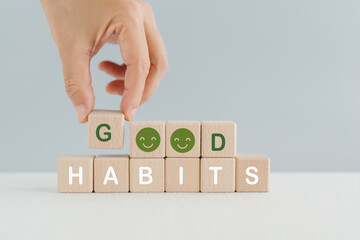 hand arranged good habits text with smiling face instead of O, for build good habits concept