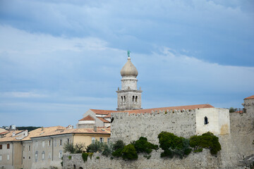 Fototapeta na wymiar View of the Church of Assumption of the Blessed Virgin Mary and fortress walls in Krk, on Krk island in Croatia
