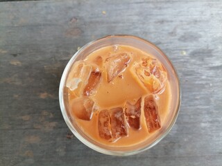 Iced tea on brown wood background