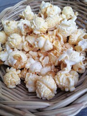 Popcorn caramel on brown wood background