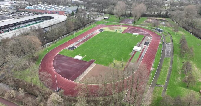 Aerial view birds eye drone view of a running track oval field, athletics, and sports.