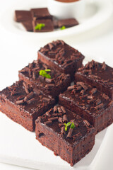 Delicious chocolate brownies with mint on white background. Sweet cake concept. 