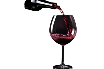 Fotobehang Red Wine Pouring into a clear glass isolated on transparent and white background.PNG image. © CStock