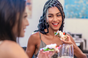 Shared Joy: A Moment of Connection Over Cuisine - Joyful Woman Eating Gourmet Food