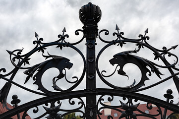 Fototapeta na wymiar Top of the street fence with dragons