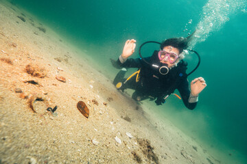 A funny girl scuba diving in Brazil - ilha grande