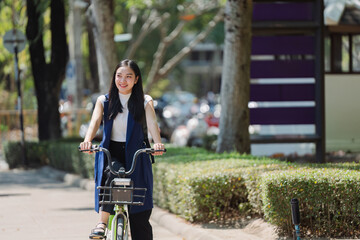 Professional Business woman with bike in the morning walking in the street to work. Eco friendly
