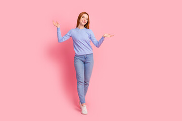Full size photo of good mood girl wear stylish pullover jeans arms comparing products empty space...