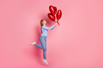Full size photo of good mood lovely girl wear stylish pullover receive heart shape balloons on...